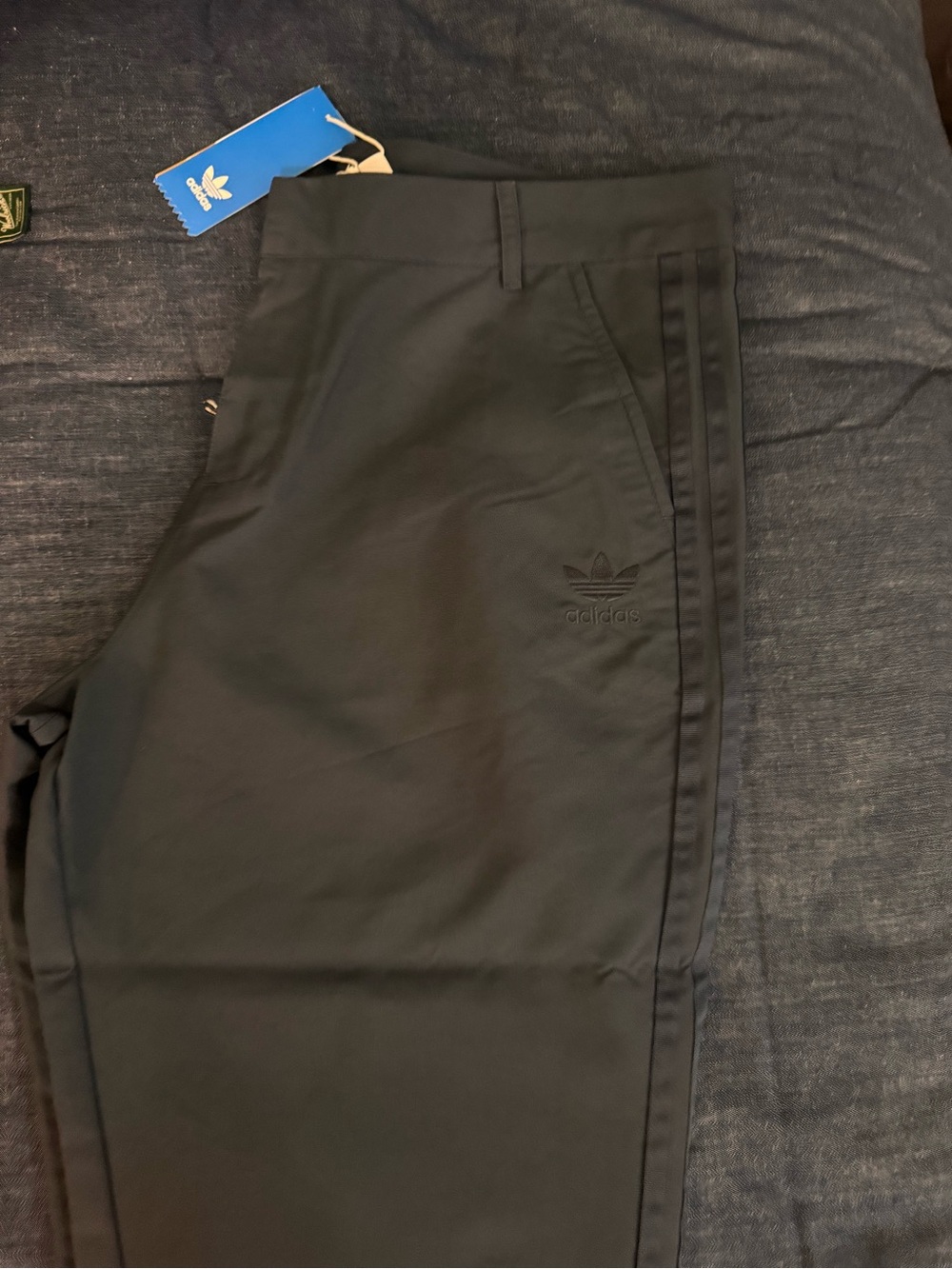 Women These pants are the adidas Originals 3-Stripes Pleated Pants.
